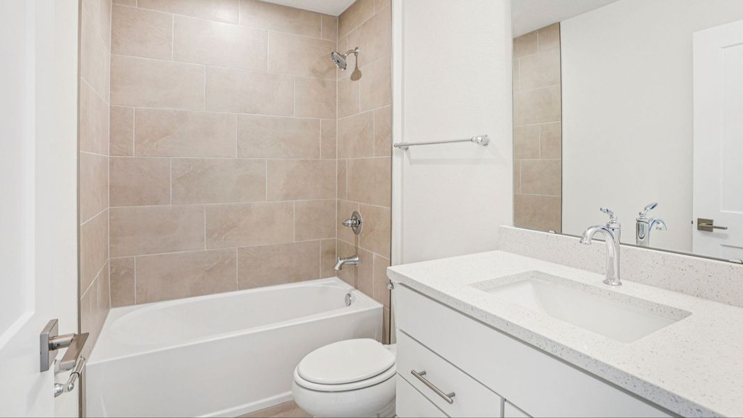Luxurious owner's bath with soaking tub and tile surround in the Plumeria at Lakeside at Satilla. Luxurious owner's bath with soaking tub and tile surround in the Plumeria at Lakeside at Satilla.