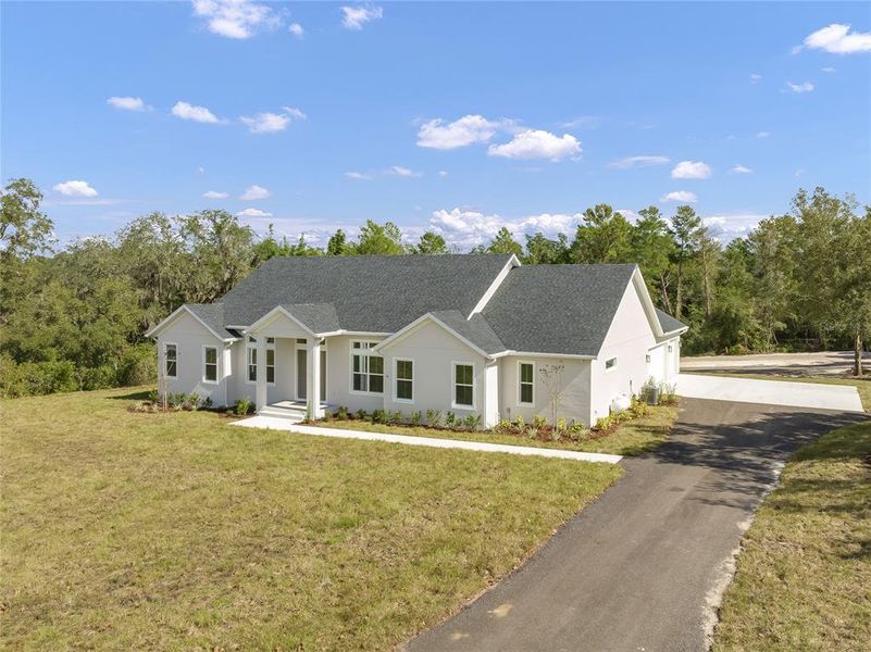 Front exterior of a new home in , Debary, FL, highlighting curb appeal (Image 33). Front exterior of a new home in , Debary, FL, highlighting curb appeal (Image 33).