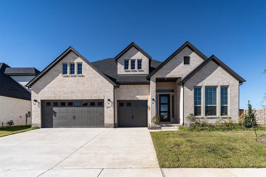Front exterior of a new home in Green Meadows, Celina, TX, highlighting curb appeal (Image 2). Front exterior of a new home in Green Meadows, Celina, TX, highlighting curb appeal (Image 2).