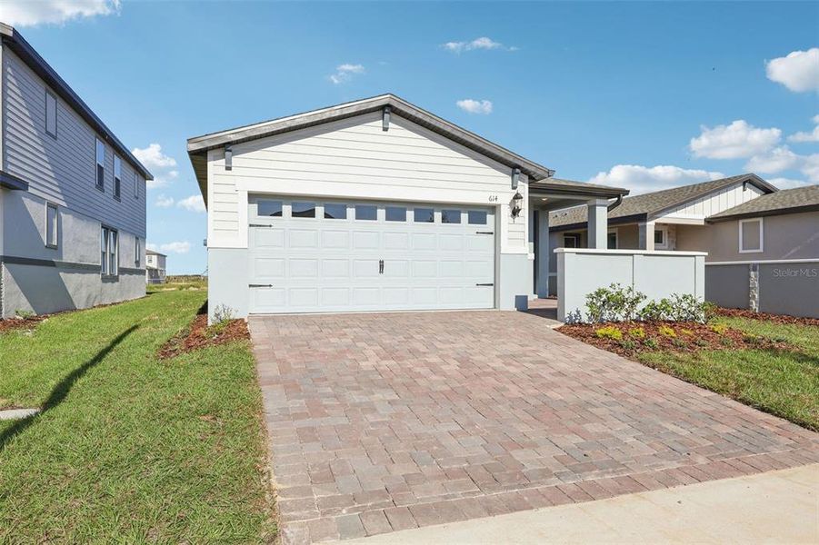 Front exterior of a new home in , Lake Alfred, FL, highlighting curb appeal (Image 19).
