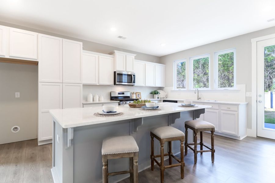 Representative furnished interior of a home built from the Inverness P by True Homes in Homecoming, Ravenel (Image 2).