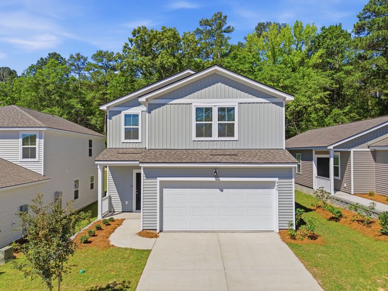 Front exterior of a new home in Grand Arbor, Blythewood, SC, highlighting curb appeal (Image 1). Front exterior of a new home in Grand Arbor, Blythewood, SC, highlighting curb appeal (Image 1).