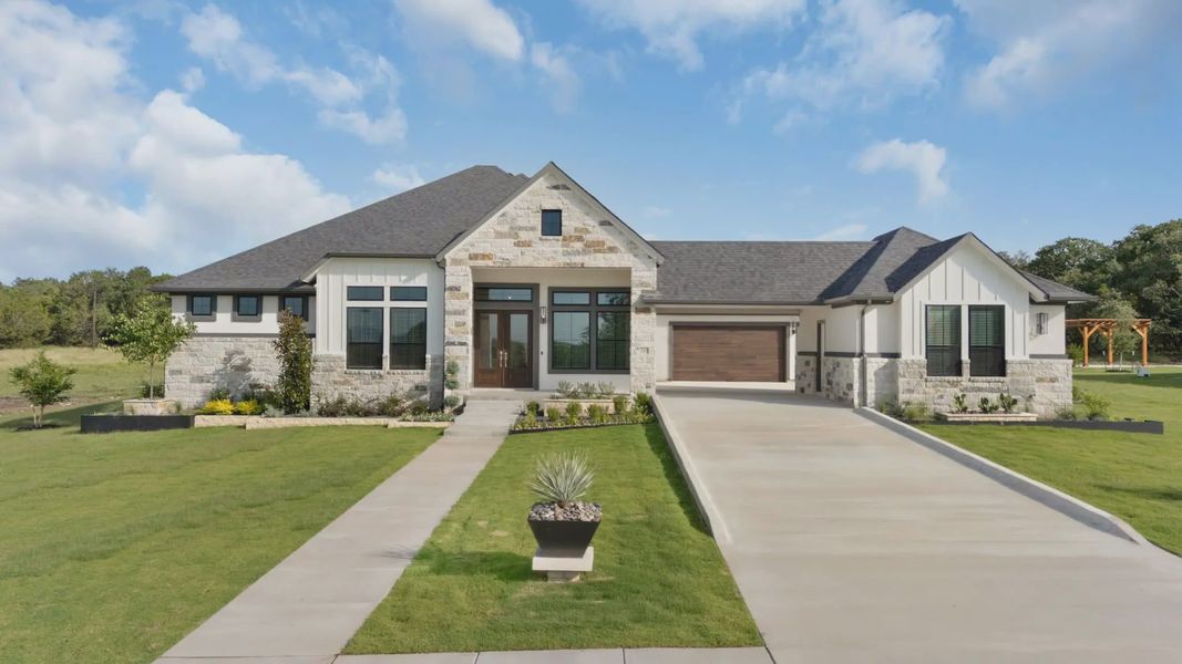 Representative exterior photo of a completed home built from the Franklin by Chesmar Homes in Feathergrass, Fulshear, TX (Image 25).