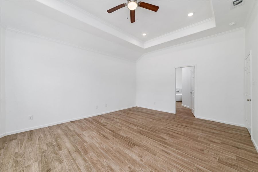 Primary suite with door to luxurious bathroom. Primary suite with door to luxurious bathroom.