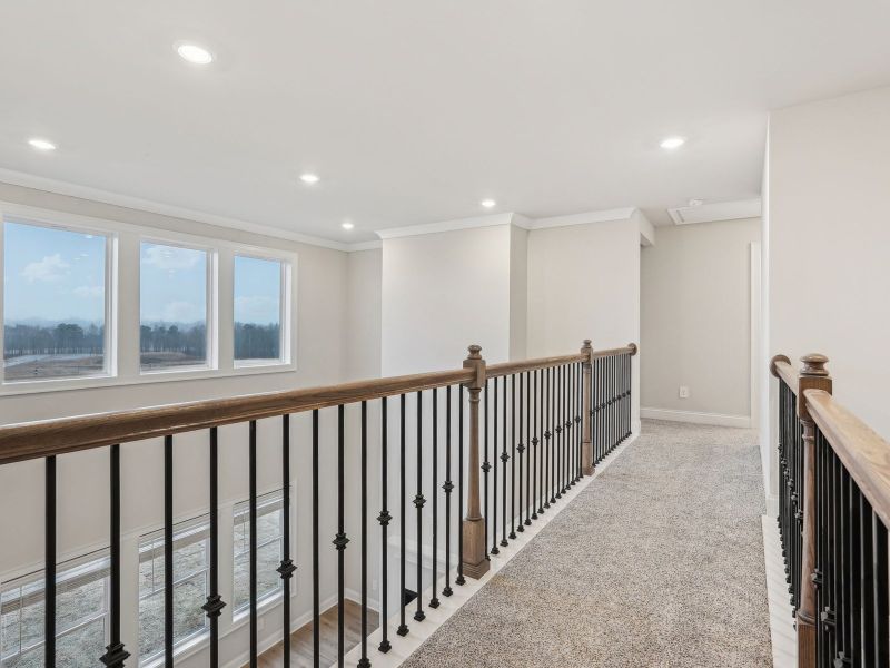 The view from the upstairs overlooks into the living room.