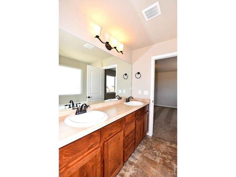 Furnished interior view inside a new home in Union Colony West, Greeley (Image 27).