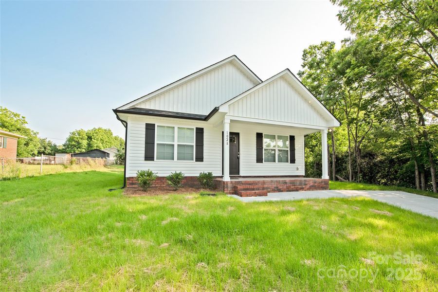 Front exterior of a new home in , Albemarle, NC, highlighting curb appeal (Image 1).
