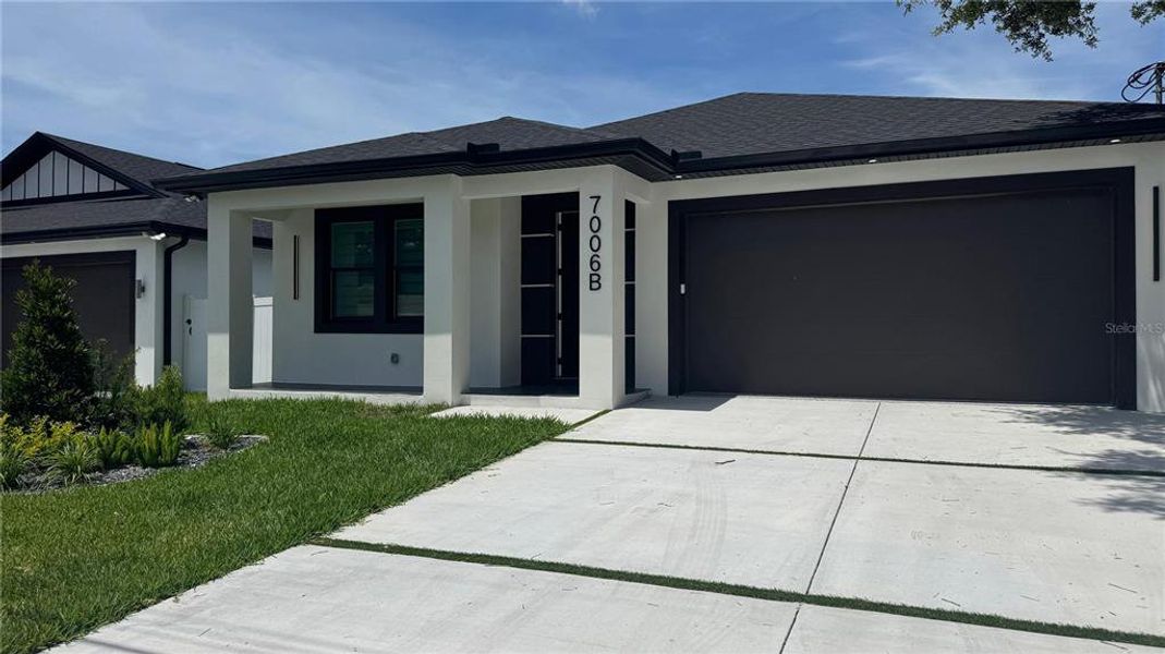 Front exterior of a new home in , Tampa, FL, highlighting curb appeal (Image 36).