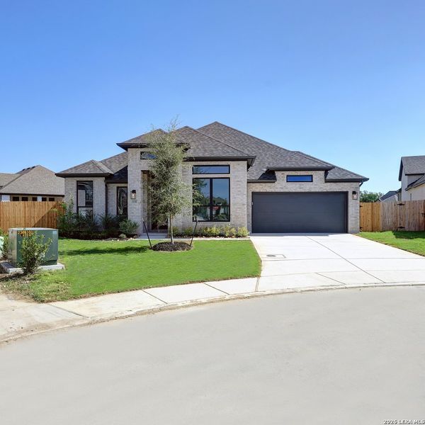 Front exterior of a new home in Alsatian Oaks, Castroville, TX, highlighting curb appeal (Image 22).