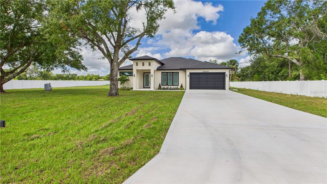 Front exterior of a new home in , Ruskin, FL, highlighting curb appeal (Image 1). Front exterior of a new home in , Ruskin, FL, highlighting curb appeal (Image 1).