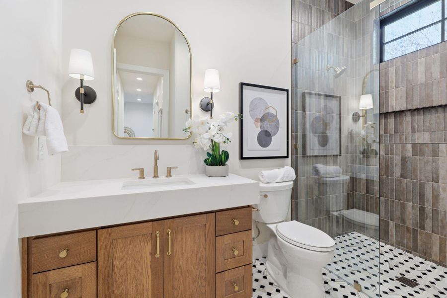 Bathroom featuring vanity and a walk in shower
