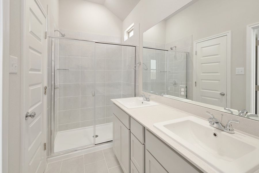 Primary Bathroom in the Ash home plan by Trophy Signature Homes – REPRESENTATIVE PHOTO