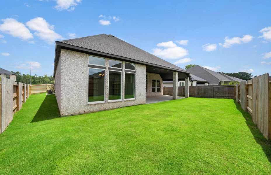 Exterior details and patio area of a home in , Magnolia (Image 3).