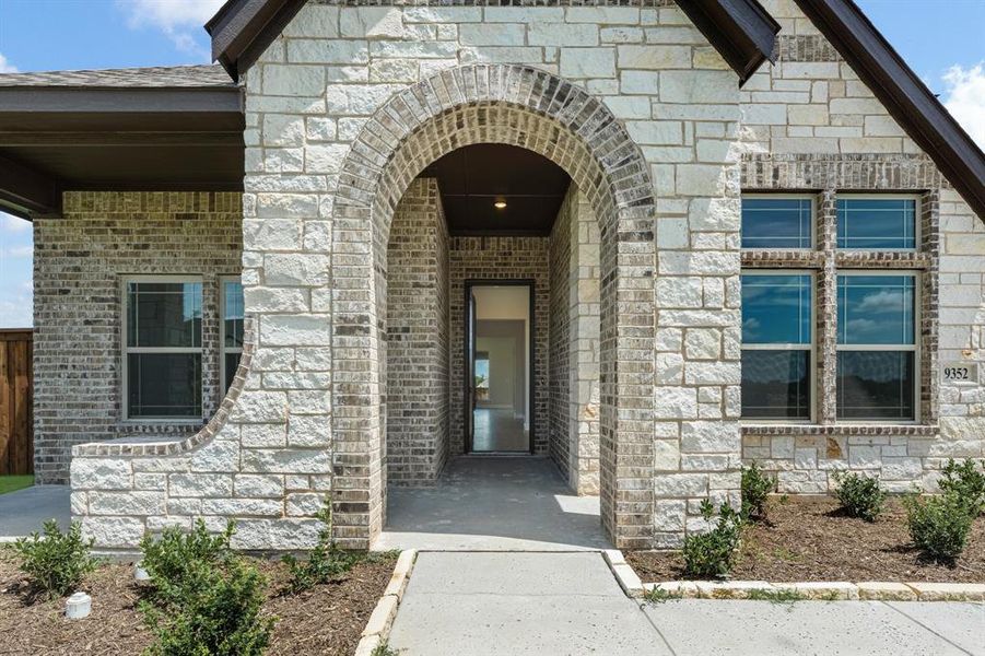Front exterior of a new home in Wildcat Ridge Phase 2 and 4, Godley, TX, highlighting curb appeal (Image 2). Front exterior of a new home in Wildcat Ridge Phase 2 and 4, Godley, TX, highlighting curb appeal (Image 2).