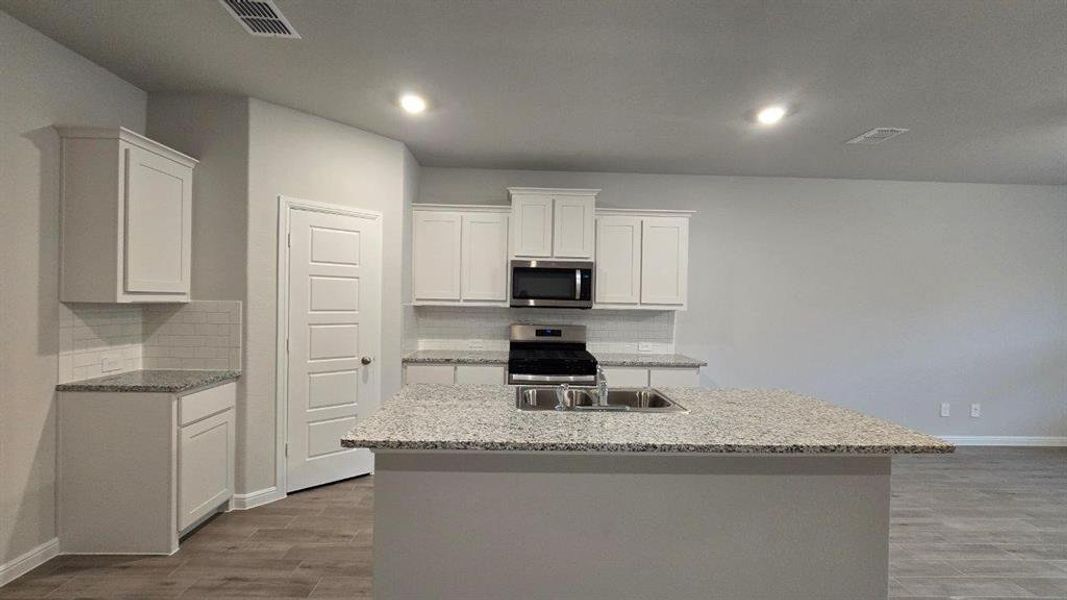 Kitchen - All Home and community information, including pricing, included features, terms, availability and amenities, are subject to change at any time without notice or obligation. All Drawings, pictures, photographs, video, square footages, floor plans, elevations, features, colors and sizes are approximate for illustration purposes only and will vary from the homes as built. Kitchen - All Home and community information, including pricing, included features, terms, availability and amenities, are subject to change at any time without notice or obligation. All Drawings, pictures, photographs, video, square footages, floor plans, elevations, features, colors and sizes are approximate for illustration purposes only and will vary from the homes as built.