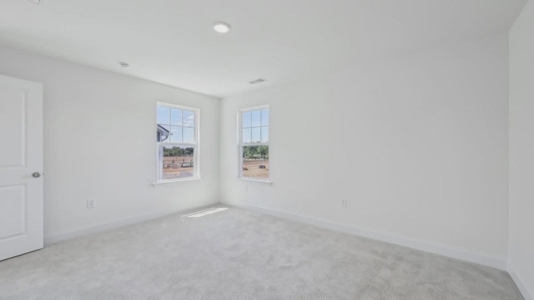Furnished interior view inside a new home in Sidney Creek Single Family, Zebulon (Image 13).