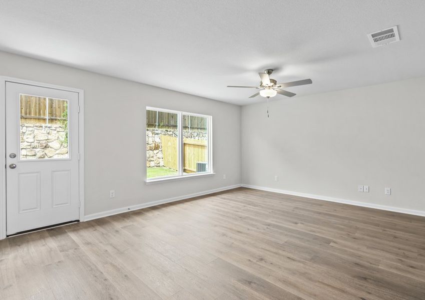 The family room is spacious and has large windows. The family room is spacious and has large windows.