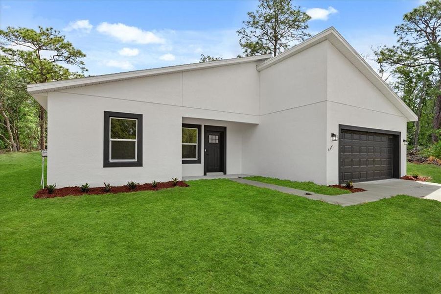 Front exterior of a new home in , Dunnellon, FL, highlighting curb appeal (Image 16).