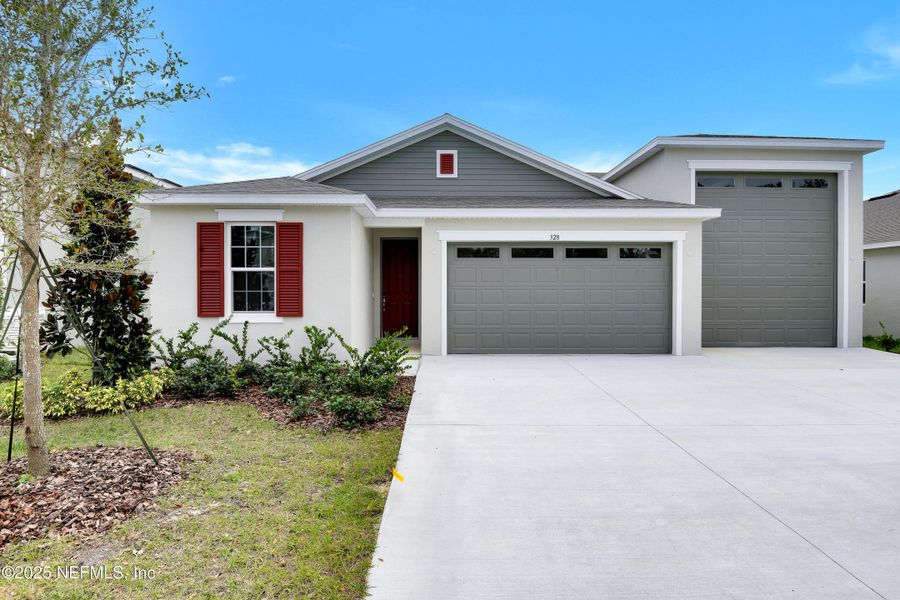 Front exterior of a new home in Seasons at Grandview Gardens, Deland, FL, highlighting curb appeal (Image 2).