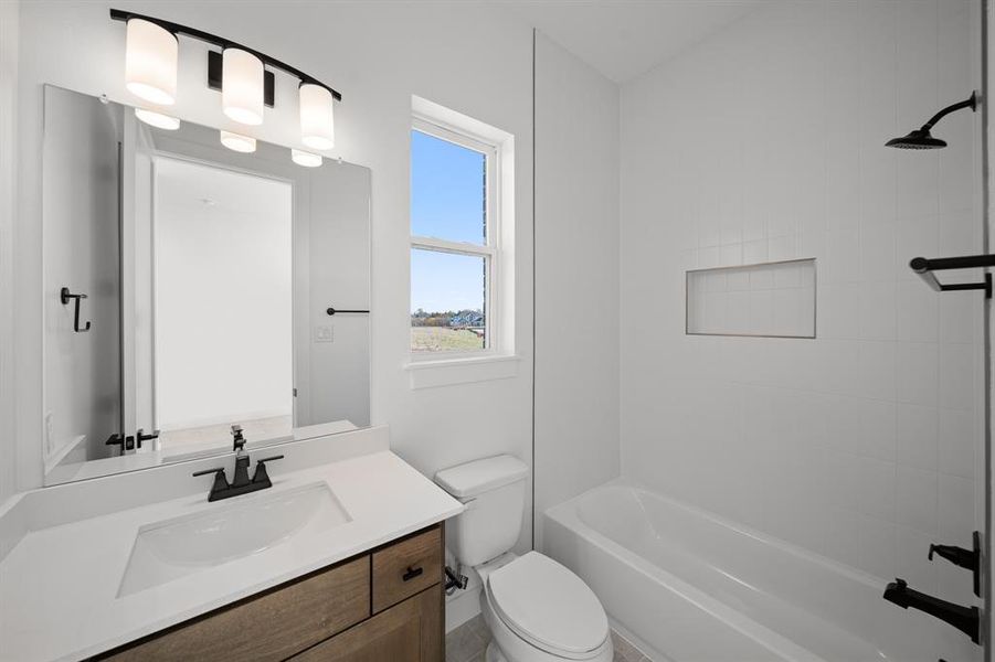 Full bath featuring vanity and tub / shower combination