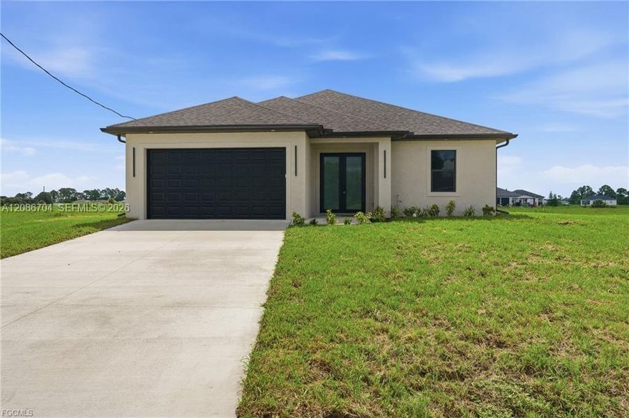 Front exterior of a new home in , Labelle, FL, highlighting curb appeal (Image 2). Front exterior of a new home in , Labelle, FL, highlighting curb appeal (Image 2).