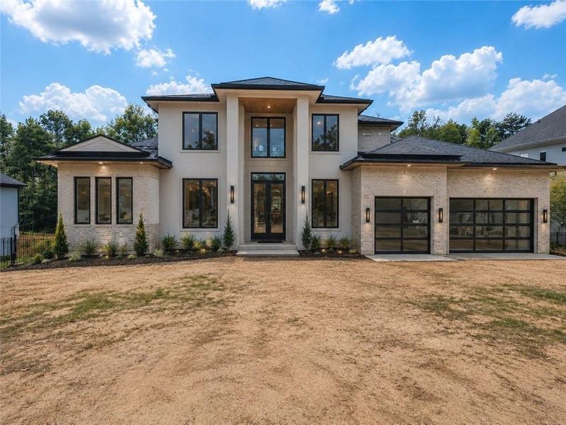 Front exterior of a new home in , Flowery Branch, GA, highlighting curb appeal (Image 3). Front exterior of a new home in , Flowery Branch, GA, highlighting curb appeal (Image 3).