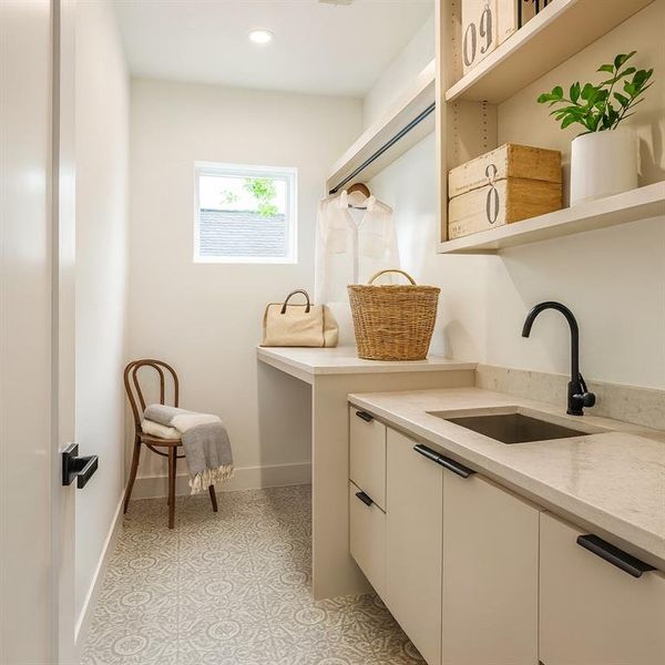 Washroom featuring a sink and recessed lighting