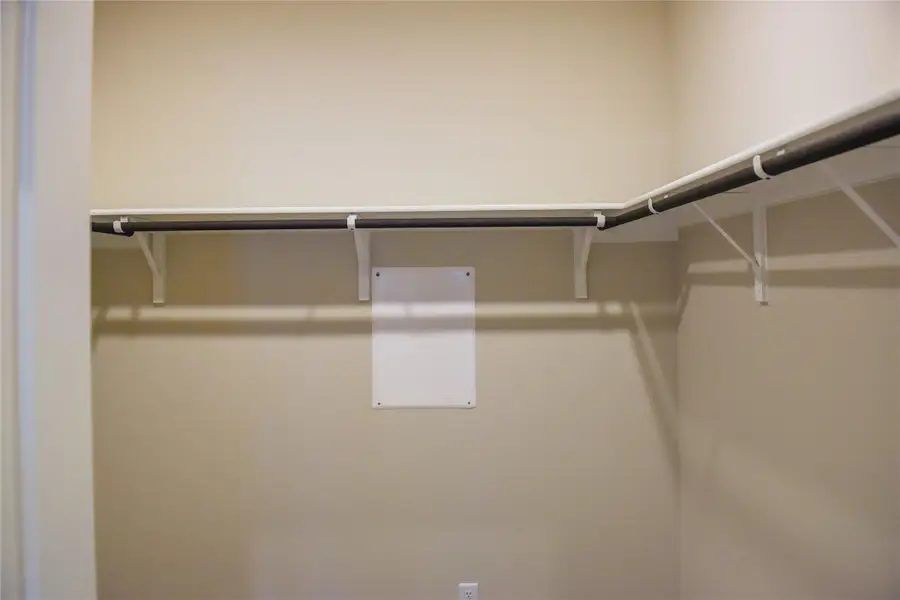 Walk-in closet in Primary Bedroom Walk-in closet in Primary Bedroom