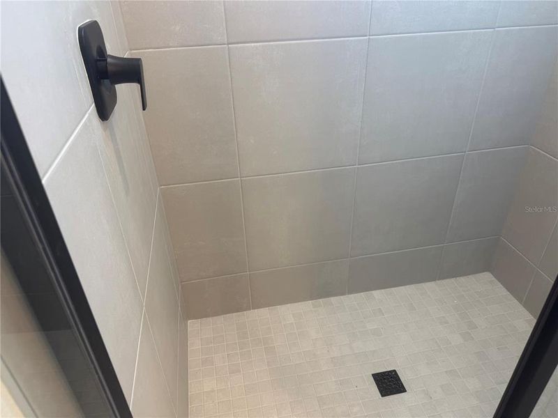 Tiled Owner's Suite Shower.