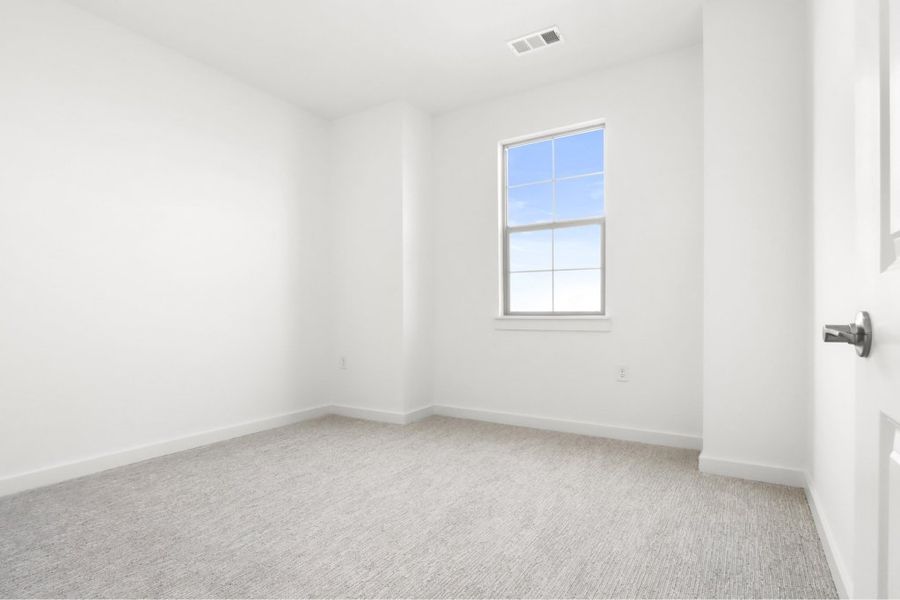 Spacious, unfurnished interior of a new home in The Tribute, The Colony (Image 17).