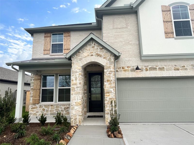 Front exterior of a new home in , Richmond, TX, highlighting curb appeal (Image 26). Front exterior of a new home in , Richmond, TX, highlighting curb appeal (Image 26).