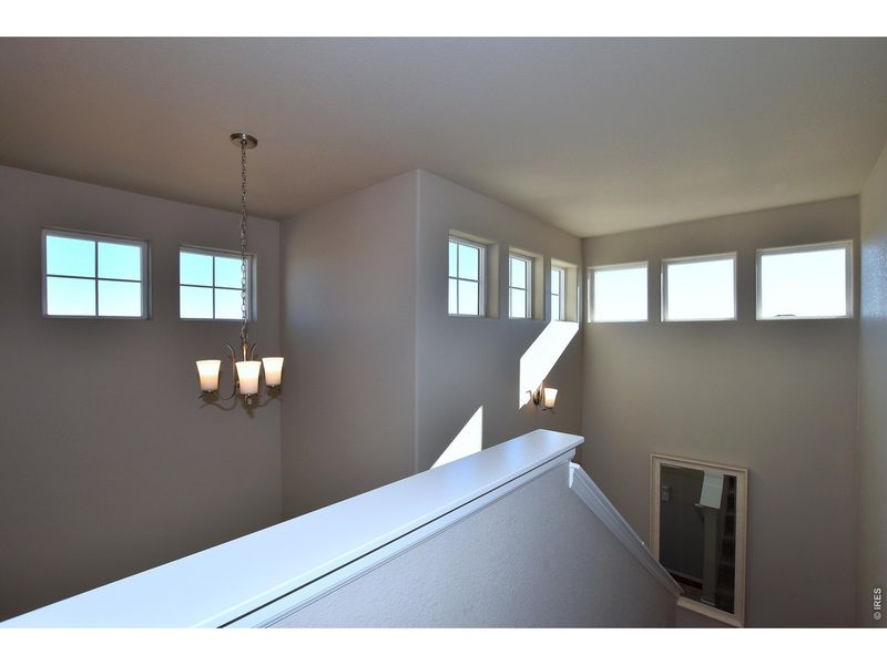 Spacious, unfurnished interior of a new home in Union Colony West, Greeley (Image 36).