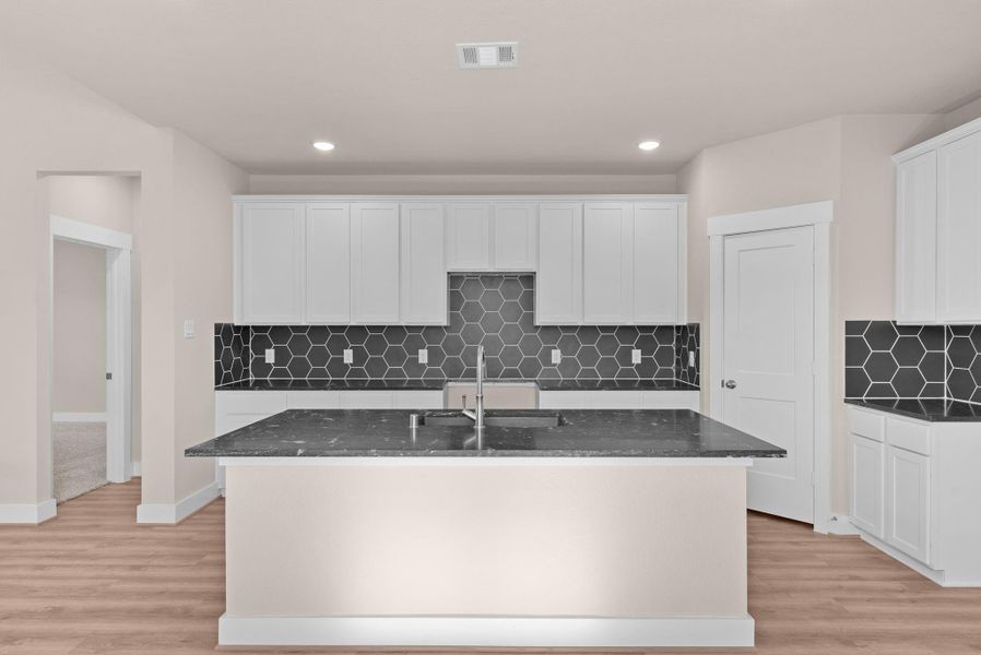 With its seamless layout and airy design, the kitchen invites effortless cooking, conversation, and connection. With its seamless layout and airy design, the kitchen invites effortless cooking, conversation, and connection.