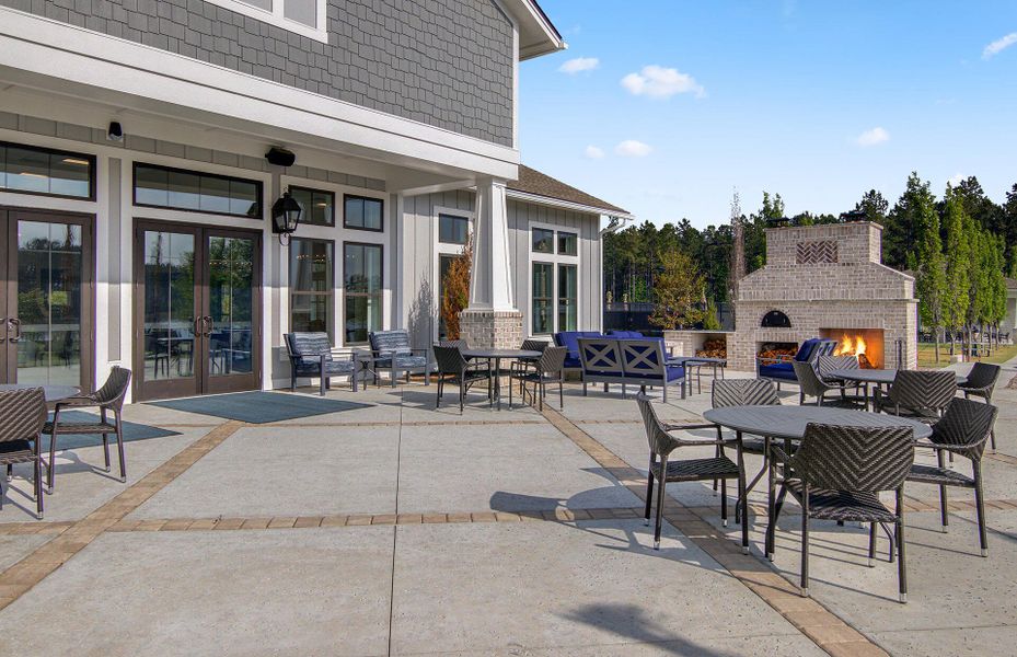 Exterior details and patio area of a home in K. Hovnanian's® Four Seasons at Lakes of Cane Bay, Summerville (Image 30).