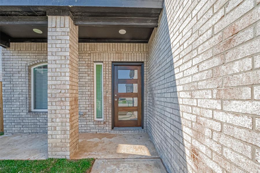 Exterior details and patio area of a home in Mill Creek Trails, Magnolia (Image 24).