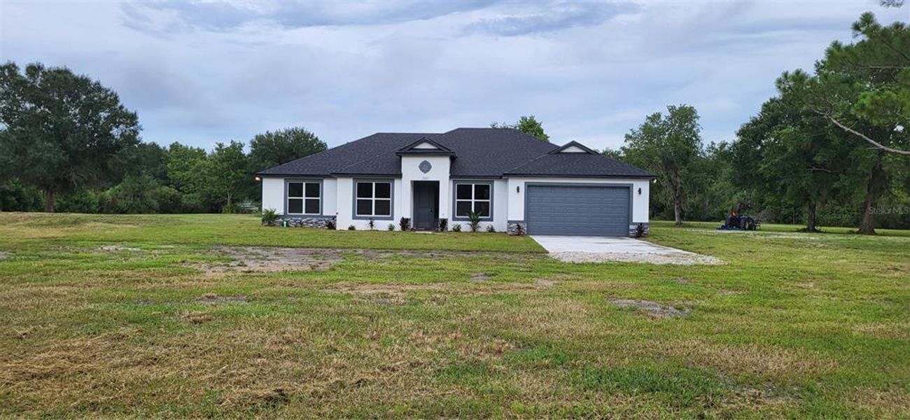 Front exterior of a new home in , Geneva, FL, highlighting curb appeal (Image 1). Front exterior of a new home in , Geneva, FL, highlighting curb appeal (Image 1).