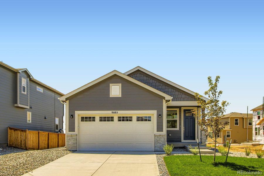 Front exterior of a new home in Buffalo Highlands – Commerce City, Commerce City, CO, highlighting curb appeal (Image 20).