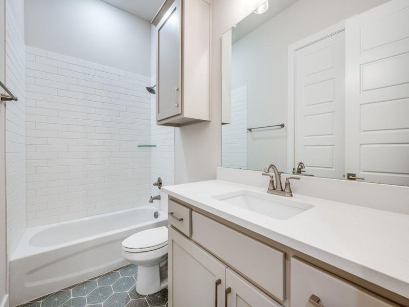 Full bathroom featuring toilet, bathing tub / shower combination, and vanity