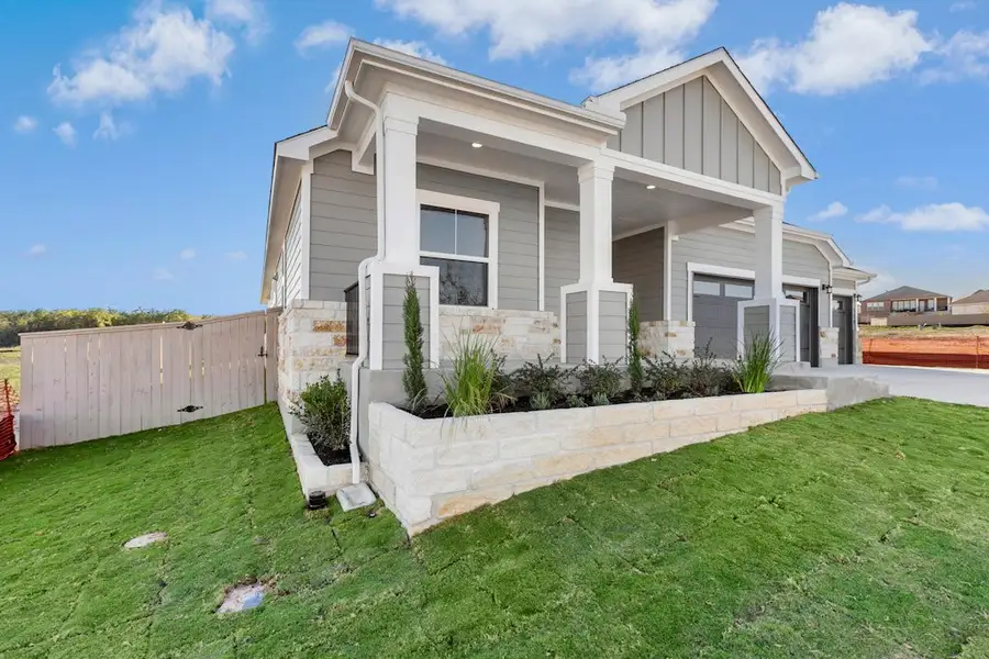 Exterior details and patio area of a home in The Colony, Bastrop (Image 3).