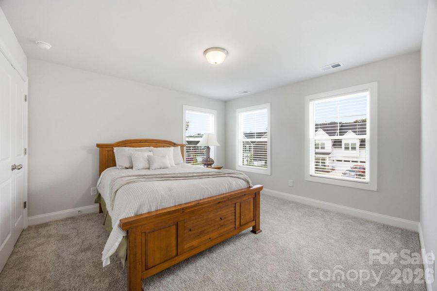 1 of 3 secondary bedrooms upstairs. This room is located at the front of the home just off the flex area.
