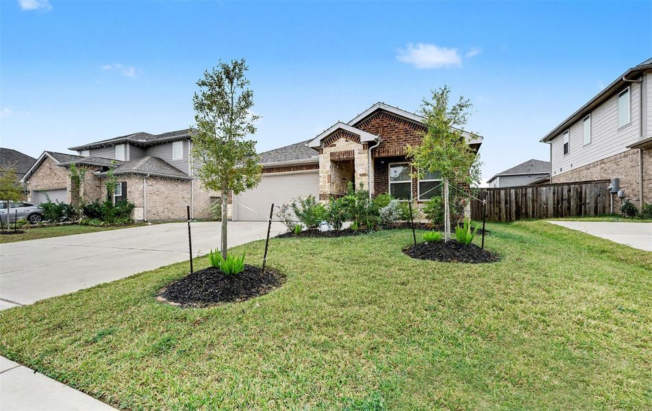 Front exterior of a new home in Heights of Barbers Hill, Baytown, TX, highlighting curb appeal (Image 1).