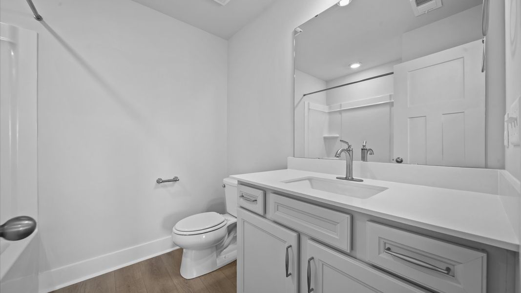 First-class guest bath featuring stylish fixtures and modern design elements