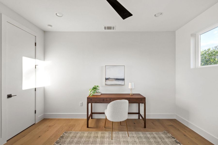 Office space featuring light wood-style flooring and recessed lighting Office space featuring light wood-style flooring and recessed lighting