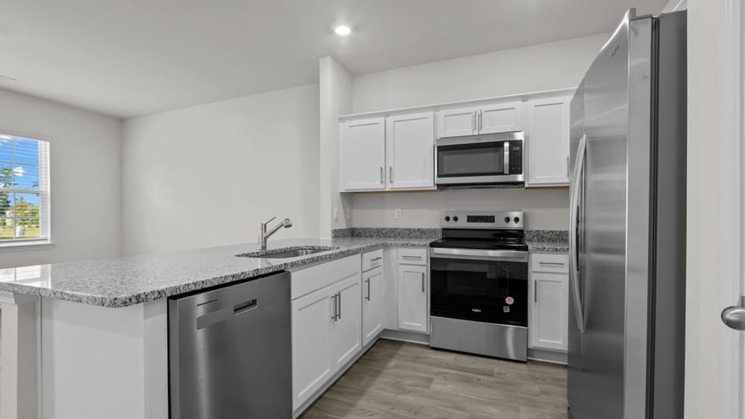 Furnished interior view inside a new home in The Townes at Ridgewood Farms, Winterville (Image 5).