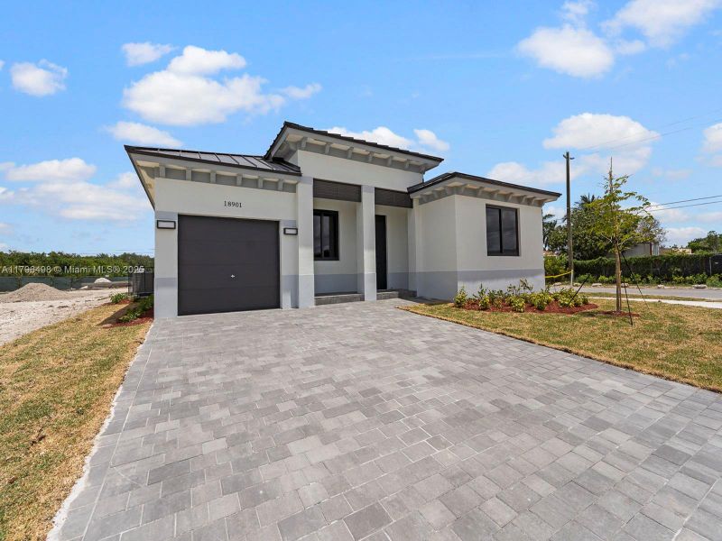 Front exterior of a new home in , Homestead, FL, highlighting curb appeal (Image 2).
