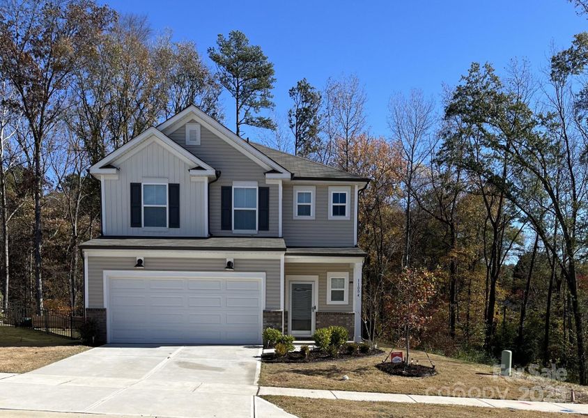 Front exterior of a new home in , Charlotte, NC, highlighting curb appeal (Image 1).