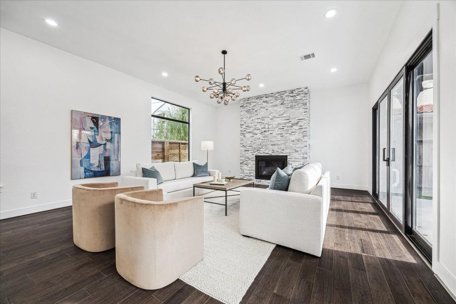 From this angle, the living room is bathed in sunlight, showcasing its open design.