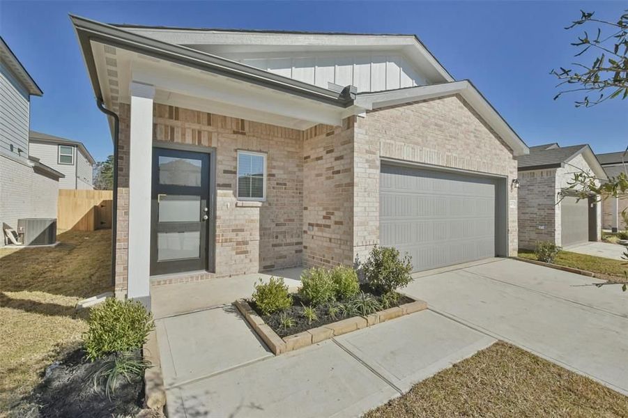 Front exterior of a new home in Lakes at Black Oak, Magnolia, TX, highlighting curb appeal (Image 36).
