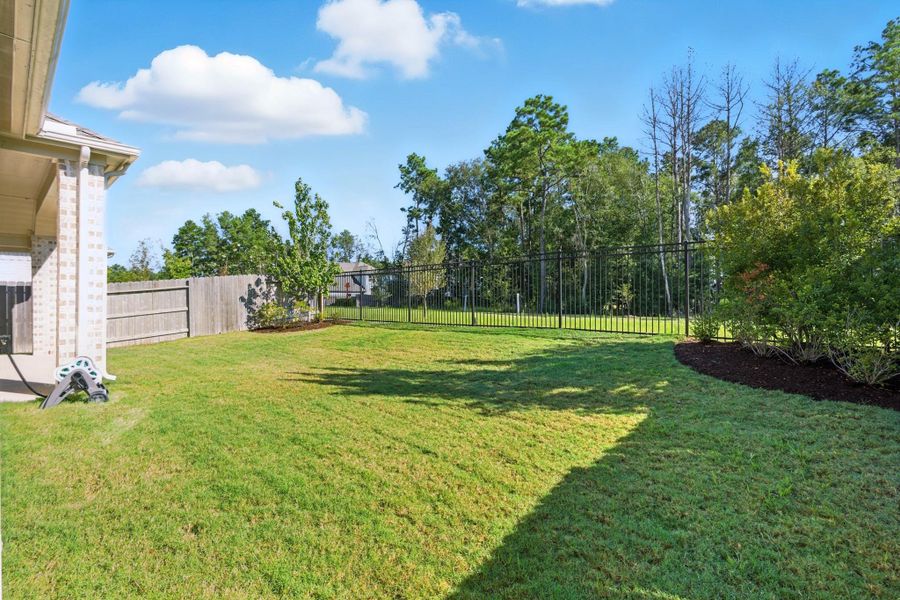 Spacious yard perfect for play or a pool. Spacious yard perfect for play or a pool.