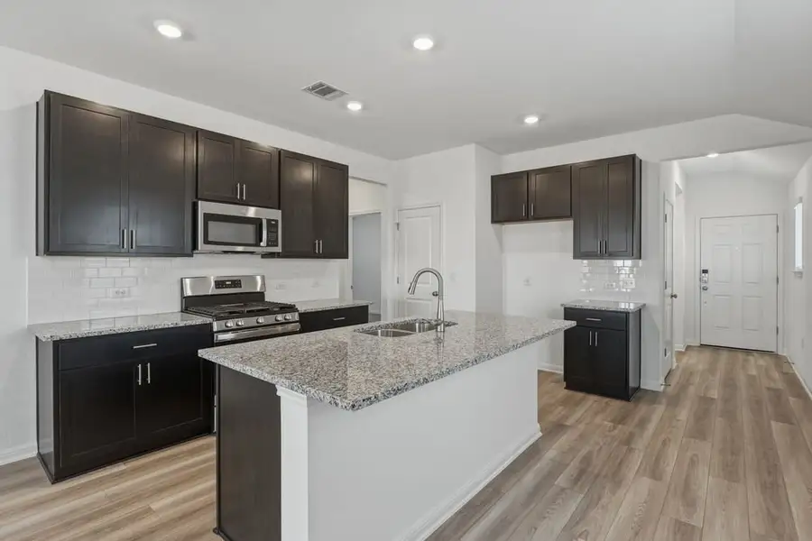 Furnished interior view inside a new home in Longview, Del Valle (Image 5).